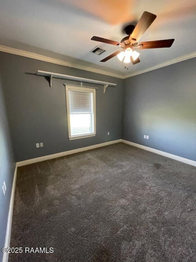 carpeted spare room featuring crown molding, a ceiling fan, and baseboards