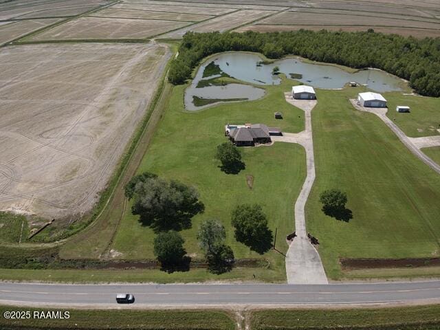 aerial view of property and surrounding area with a large body of water