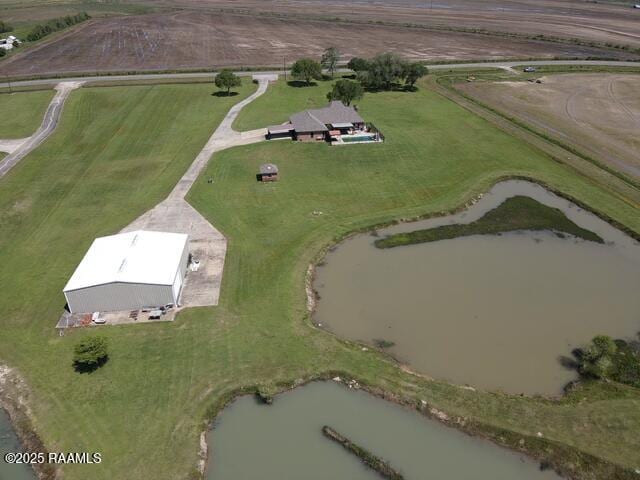aerial view of property and surrounding area with rural landscape and a large body of water