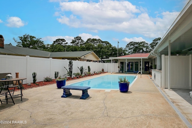 view of pool featuring a patio, a fenced backyard, and a fenced in pool