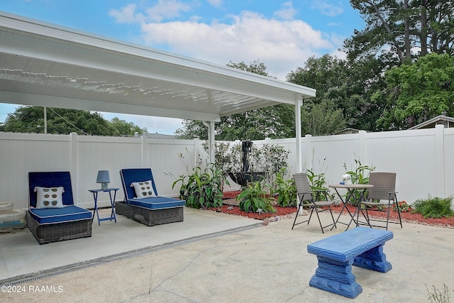 view of patio featuring a fenced backyard, outdoor dining space, and a pergola