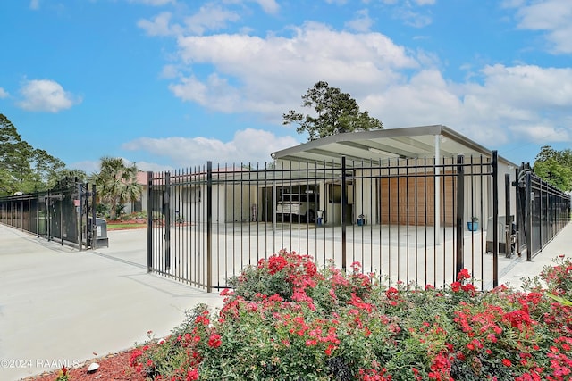 exterior space with fence and a gate