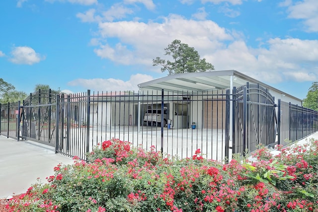 exterior space featuring fence and a gate