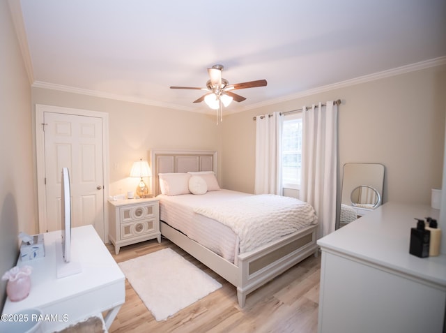 bedroom with light wood-type flooring, ornamental molding, and ceiling fan