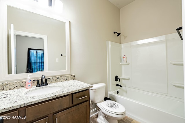 bathroom with shower / washtub combination, vanity, and toilet