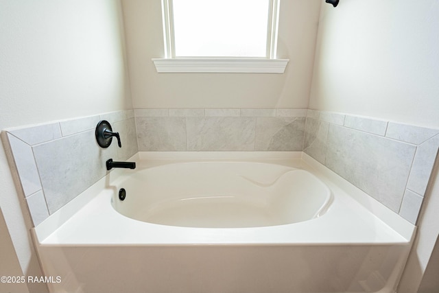 bathroom with a garden tub