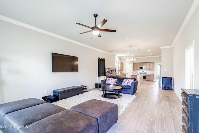 living area with ceiling fan with notable chandelier, baseboards, light wood-style floors, and crown molding