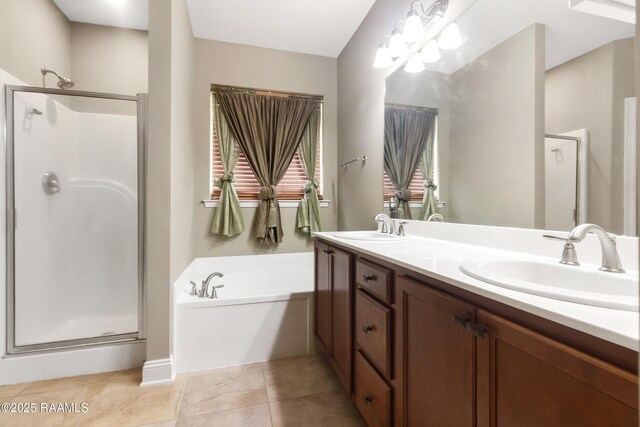 full bath featuring a shower stall, double vanity, a garden tub, and a sink