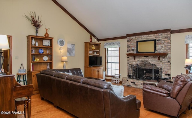 living room with light wood-type flooring, crown molding, a brick fireplace, and vaulted ceiling