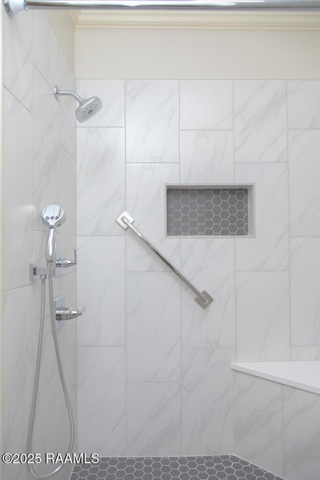 full bathroom with tiled shower