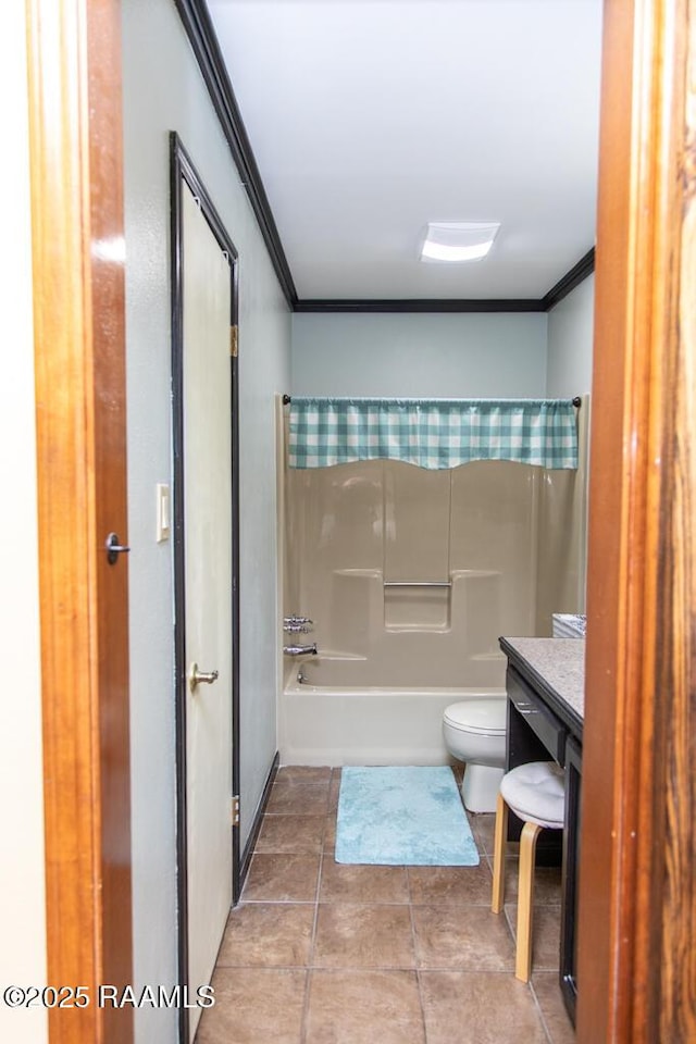 full bathroom featuring crown molding, toilet, shower / bathing tub combination, and tile patterned flooring