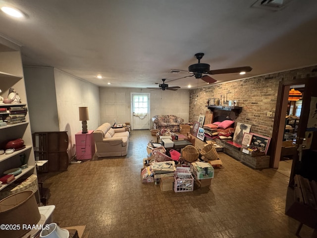 living area featuring recessed lighting, visible vents, a ceiling fan, and brick wall