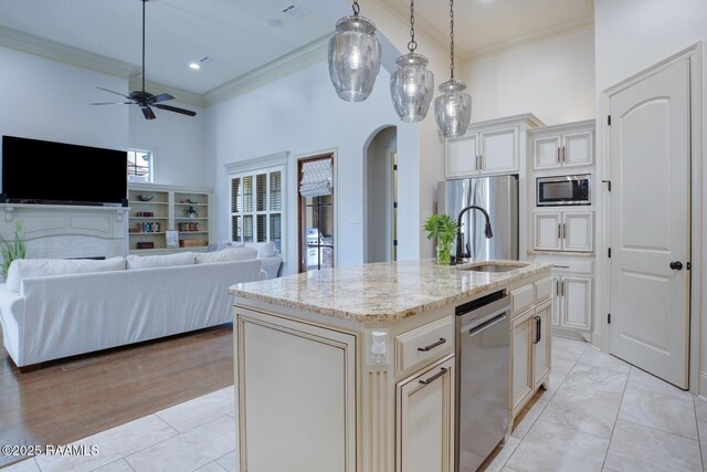 106 Rue De Chambery, Broussard, LA 70518 - kitchen featuring arched walkways, appliances with stainless steel finishes, ornamental molding, and a ceiling fan