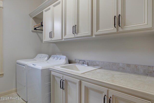 106 Rue De Chambery, Broussard, LA 70518 - washroom with cabinet space, washer and clothes dryer, tile patterned flooring, and a sink
