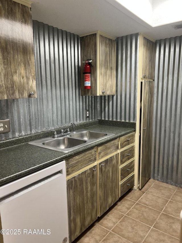 3121 Johnston St Unit 143, Lafayette, LA 70503 - kitchen with dishwasher, dark countertops, and light tile patterned floors