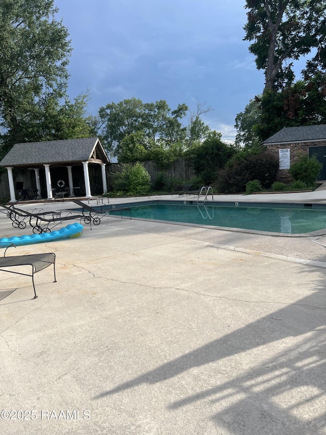 3121 Johnston St Unit 143, Lafayette, LA 70503 - community pool with a patio and an outbuilding