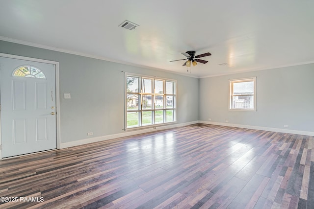 interior space with crown molding, wood finished floors, ceiling fan, and visible vents