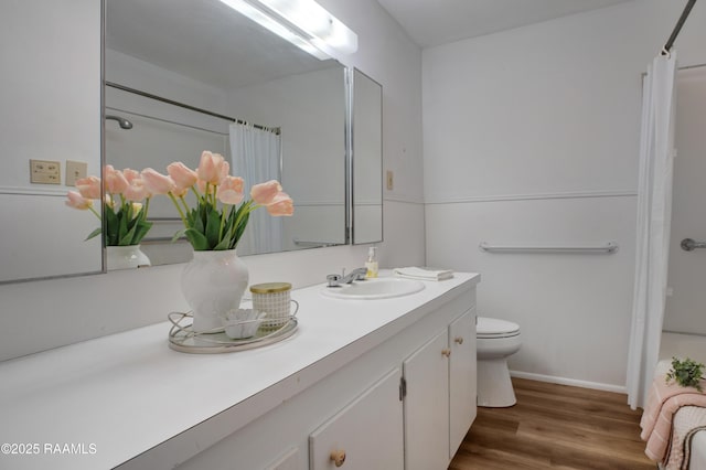 1119 Mary Lee St, Franklin, LA 70538 - bathroom featuring wood finished floors, toilet, vanity, baseboards, and curtained shower