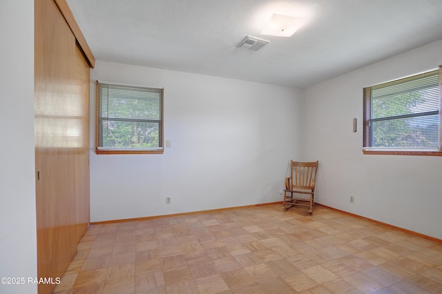 1119 Mary Lee St, Franklin, LA 70538 - unfurnished room featuring a wealth of natural light, visible vents, and baseboards