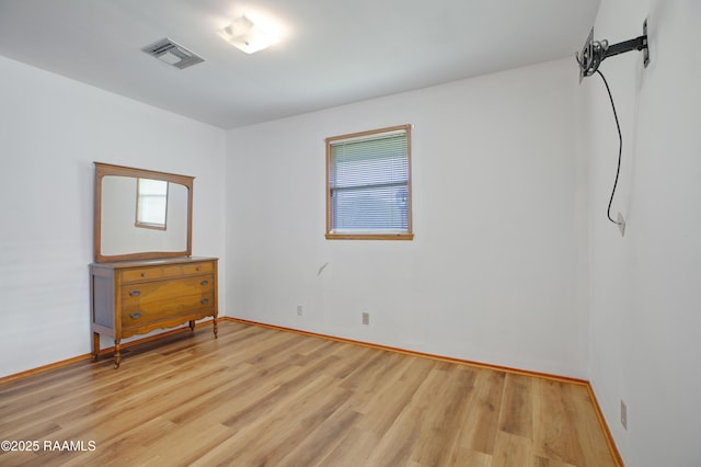1119 Mary Lee St, Franklin, LA 70538 - empty room with visible vents, light wood-style flooring, and baseboards