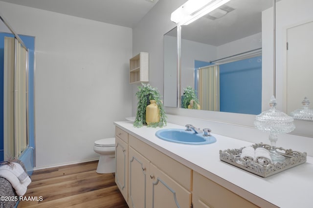 1119 Mary Lee St, Franklin, LA 70538 - bathroom with an enclosed shower, visible vents, toilet, wood finished floors, and vanity