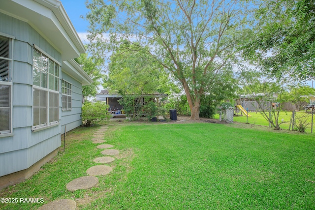 1119 Mary Lee St, Franklin, LA 70538 - view of yard featuring a playground and fence