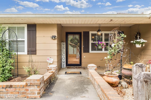 property entrance featuring a porch