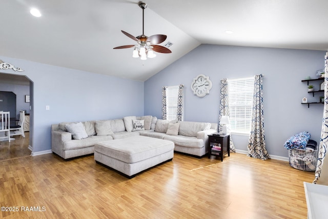 197 John Paul Dr, Opelousas, LA 70570 - living area with visible vents, arched walkways, a ceiling fan, wood finished floors, and lofted ceiling