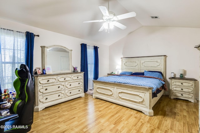 197 John Paul Dr, Opelousas, LA 70570 - bedroom featuring light wood finished floors, visible vents, ceiling fan, and vaulted ceiling