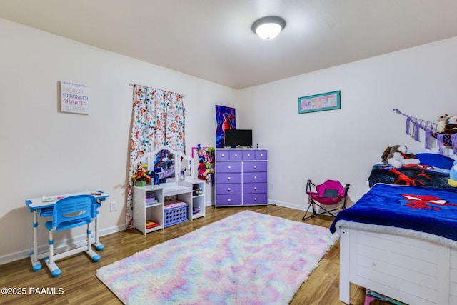 197 John Paul Dr, Opelousas, LA 70570 - bedroom featuring baseboards and wood finished floors