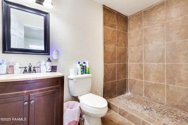 197 John Paul Dr, Opelousas, LA 70570 - full bath with vanity, a tile shower, and toilet