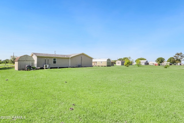 197 John Paul Dr, Opelousas, LA 70570 - view of yard with an outbuilding and a shed