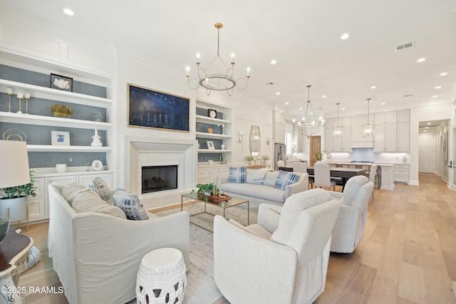 211 Crossbill Dr, Lafayette, LA 70508 - living area featuring light wood-style flooring, visible vents, recessed lighting, a chandelier, and ornamental molding