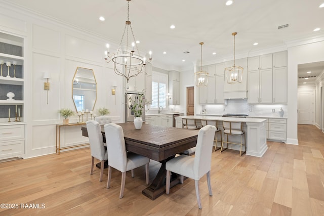 211 Crossbill Dr, Lafayette, LA 70508 - dining area featuring visible vents, an inviting chandelier, and recessed lighting