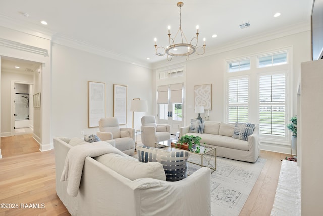 211 Crossbill Dr, Lafayette, LA 70508 - living room with plenty of natural light, visible vents, ornamental molding, and a notable chandelier