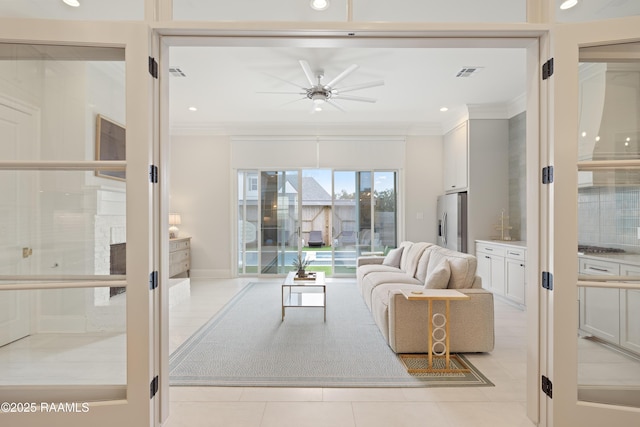 211 Crossbill Dr, Lafayette, LA 70508 - living room with ceiling fan, ornamental molding, visible vents, and light tile patterned floors