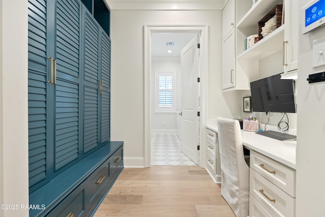 211 Crossbill Dr, Lafayette, LA 70508 - mudroom with crown molding, built in study area, light wood-style flooring, baseboards, and visible vents