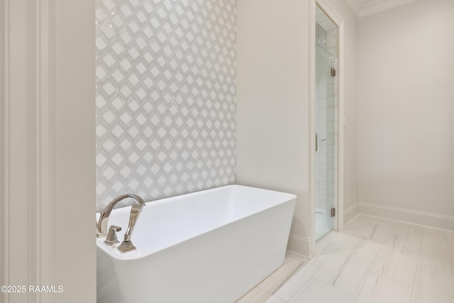 211 Crossbill Dr, Lafayette, LA 70508 - full bathroom featuring a freestanding bath, a shower stall, crown molding, and baseboards