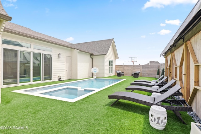 211 Crossbill Dr, Lafayette, LA 70508 - view of swimming pool featuring a lawn, a fenced backyard, and a pool with connected hot tub
