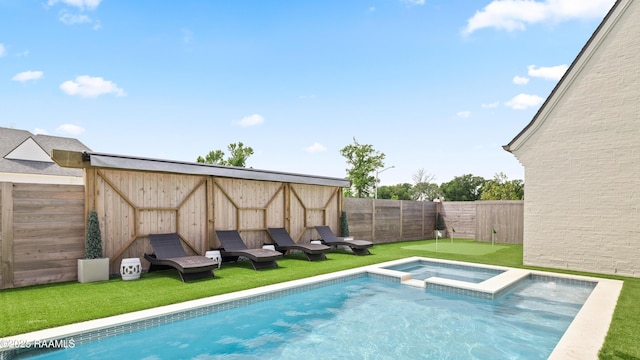 211 Crossbill Dr, Lafayette, LA 70508 - view of swimming pool featuring a fenced backyard, a pool with connected hot tub, and a lawn