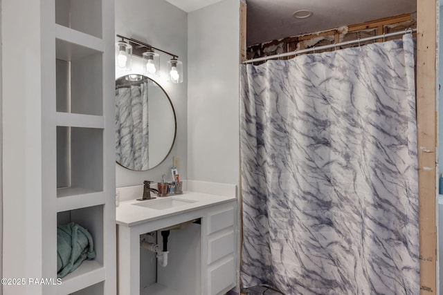 bathroom featuring a sink and a shower with shower curtain