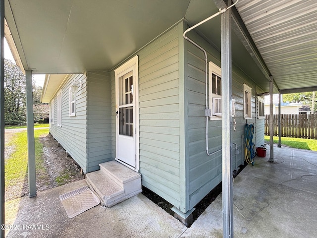 view of patio featuring entry steps and fence