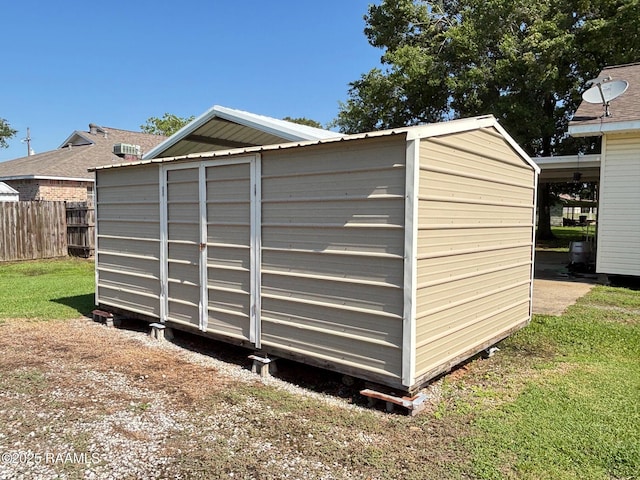 view of shed with fence