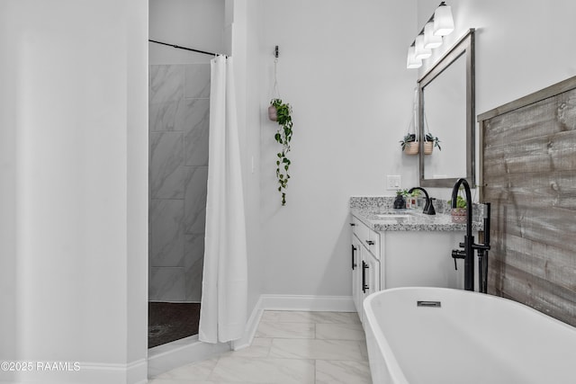full bathroom featuring tiled shower, marble finish floor, baseboards, and vanity
