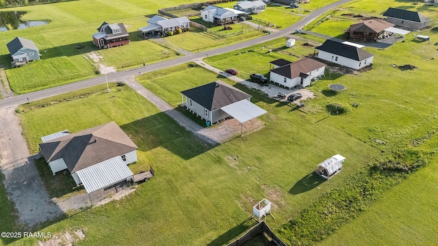 birds eye view of property featuring a residential view and a water view