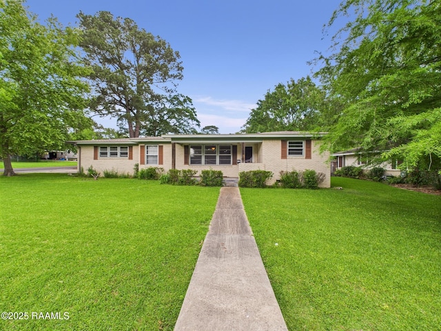 109 Indian Mound Rd, Lafayette, LA 70501 - ranch-style home with a front lawn and brick siding