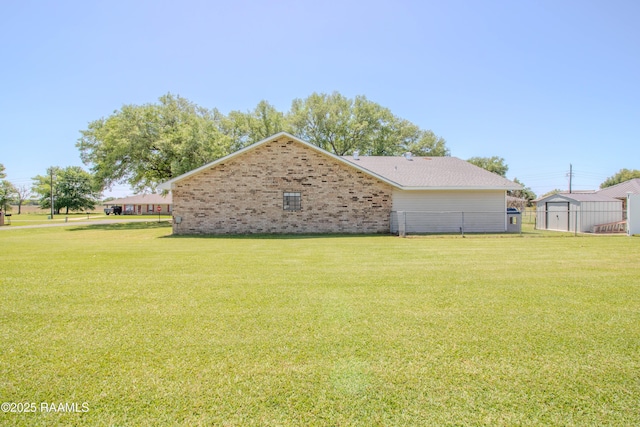 view of property exterior featuring a yard and brick siding