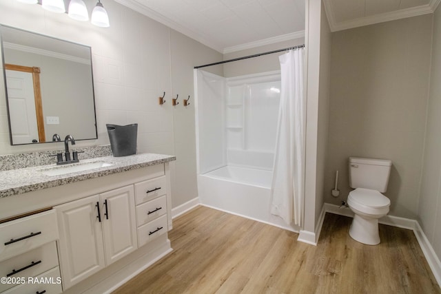 bathroom featuring vanity, crown molding, toilet, and wood finished floors