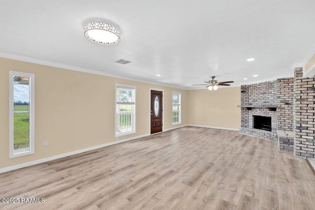7848 Lake St, Lake Charles, LA 70605 - unfurnished living room featuring crown molding, visible vents, light wood-style flooring, and a ceiling fan