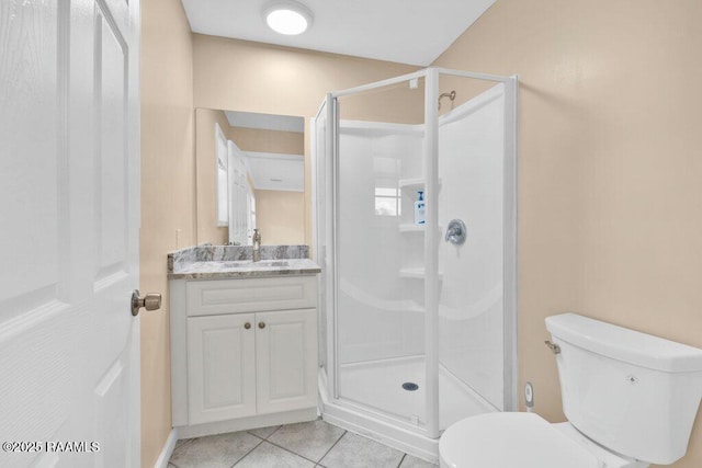 7848 Lake St, Lake Charles, LA 70605 - bathroom featuring a shower stall, tile patterned floors, vanity, and toilet